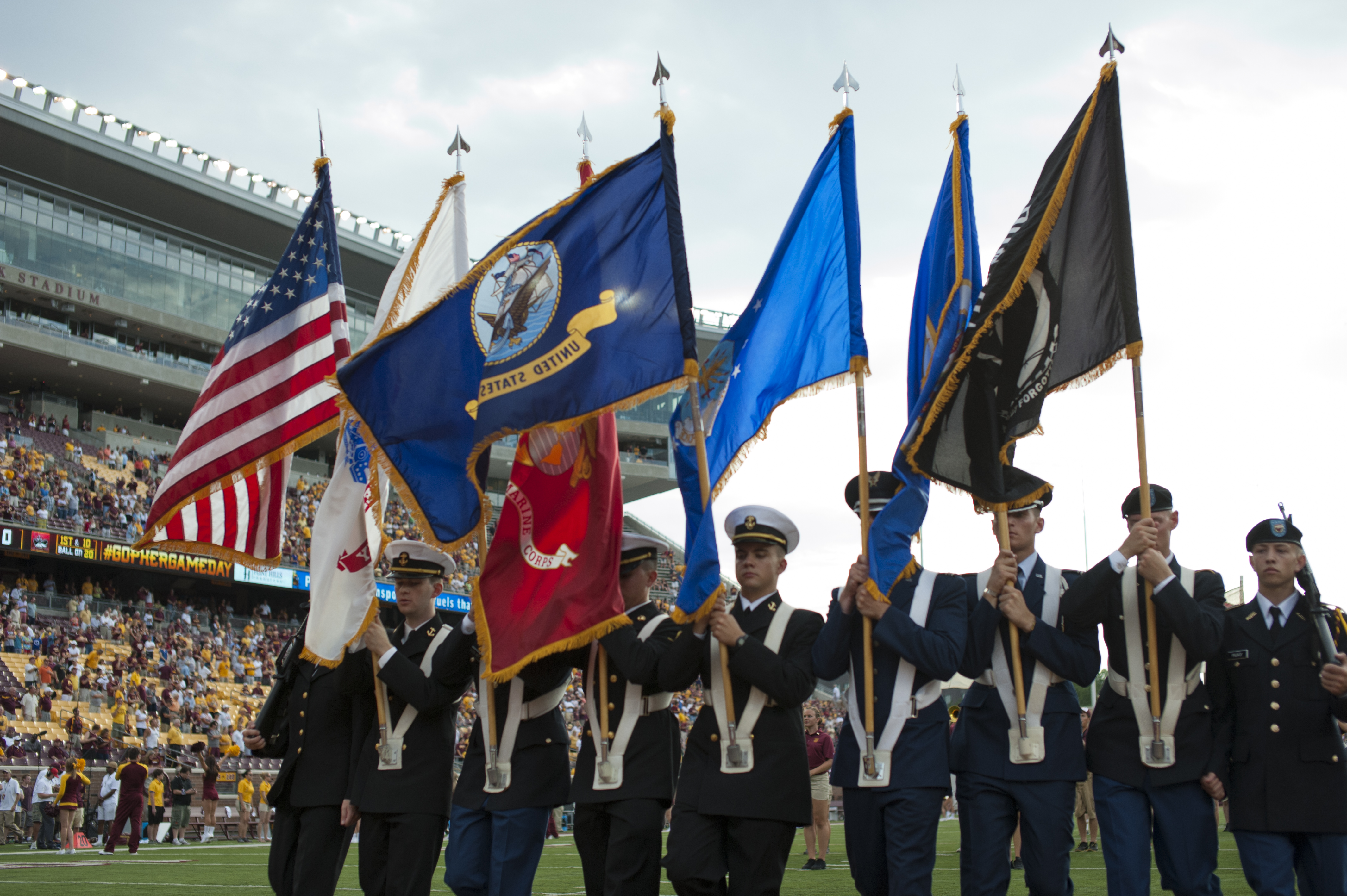 Colorguard holding various flags